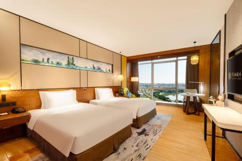 Hisilk Artwork Center Fliport Coso Hotelにあるベッド