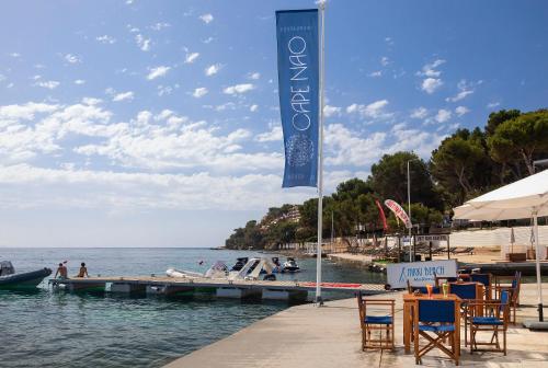 a sign on a dock next to the water at Meliá South Beach in Magaluf