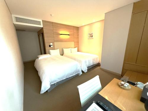 Postel nebo postele na pokoji v ubytování Acube Hotel Dongdaemun