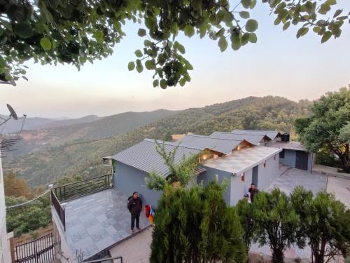 a view from the roof of a house at Woodpecker nest by lakes & woods in Mukteswar