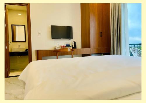 Postel nebo postele na pokoji v ubytování Aurora Hotel Măng Đen