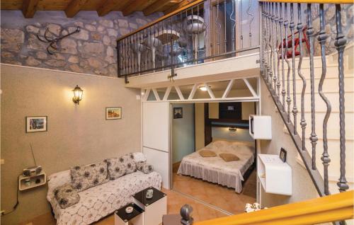 a living room with a couch and a bed at Holiday Home Zaton Veliki 37 in Trsteno