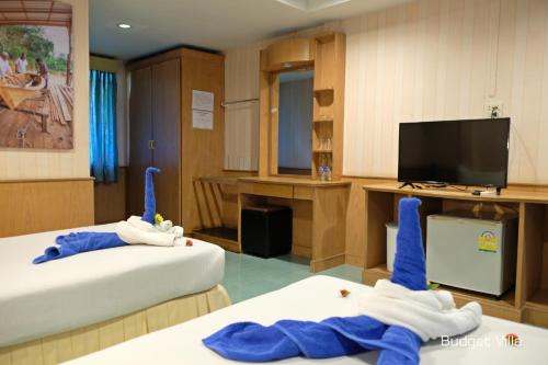 Postel nebo postele na pokoji v ubytování Andaman Lanta Resort - SHA Extra Plus