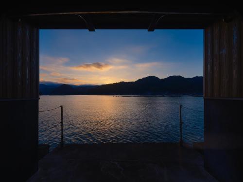 a view of a large body of water at Funaya Kura 藏 in Ine