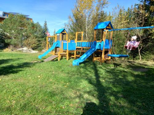 a group of playground equipment in a park at Penzión Antares in Zuberec