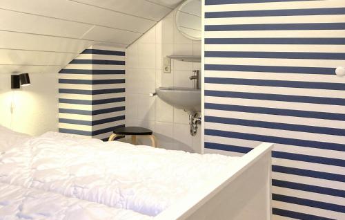 a bedroom with a white bed and a sink at Ferienhaus 16 In Kirchheim in Kirchheim