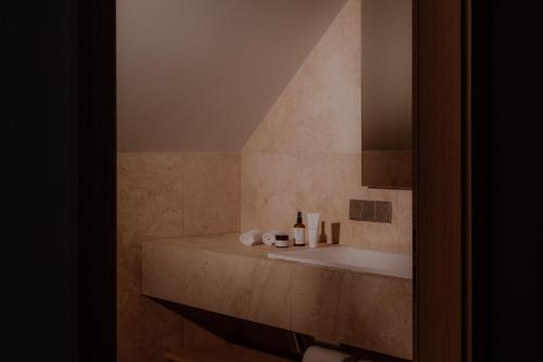 a bathroom with a sink and a mirror at Hotel Auerhahn in Schluchsee