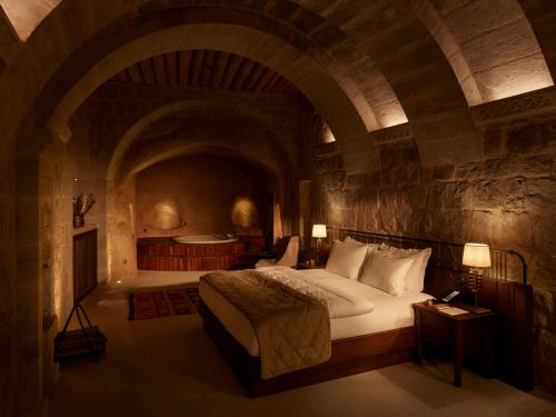 A bed or beds in a room at Argos in Cappadocia
