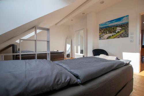 a bedroom with a large bed in a room at FeWo Wohlleben Petrus VI in Trier