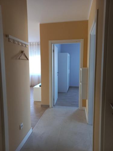 an empty room with a door and a hallway at Smart Stay Odžaci in Odžaci