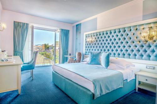Postel nebo postele na pokoji v ubytování Simfonia Boutique Hotel