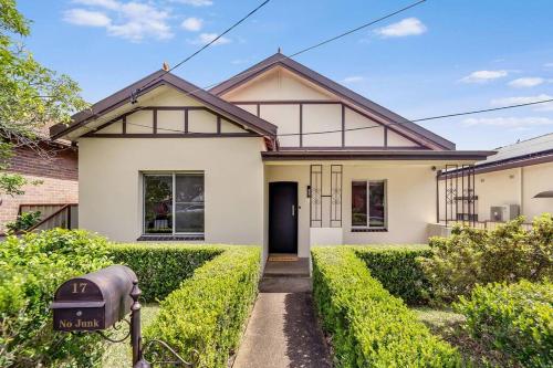 a house with a mailbox in front of it at Spacious 3-Bedroom Family Home in Concord's Heart! in Sydney
