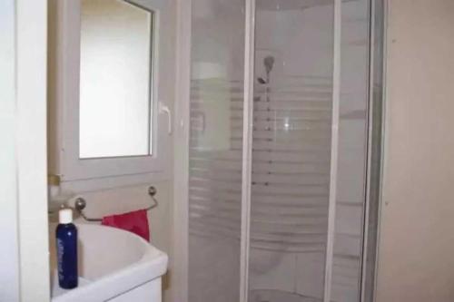 a bathroom with a shower and a white sink at Camping 4 étoiles - Parc aquatique - eebaha in Hyères