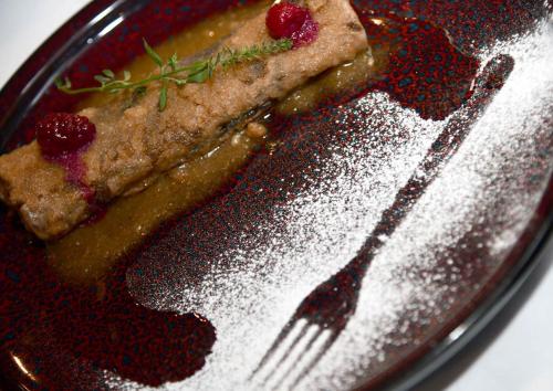 a plate of food with a piece of cake and a fork at 5 Sunca in Kašina