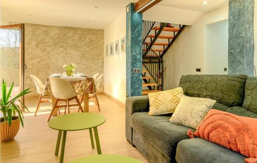 a living room with a couch and a table at 4 Bedroom Gorgeous Home In Lousame in Lousame