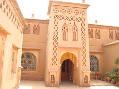 an entrance to a building with a large gate at Kasbah Ait Kassi in Boumalne
