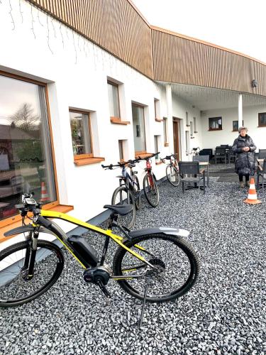 a group of bikes parked outside of a building at Cosy Sjalay near the lake for 6-8 persons in Büchel