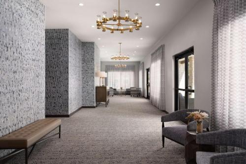 a hallway with a waiting room with a chandelier at Home2 Suites By Hilton Abilene Southwest in Abilene