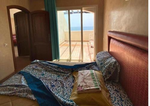 Ένα ή περισσότερα κρεβάτια σε δωμάτιο στο Appartement avec Piscine et Proche des Plages