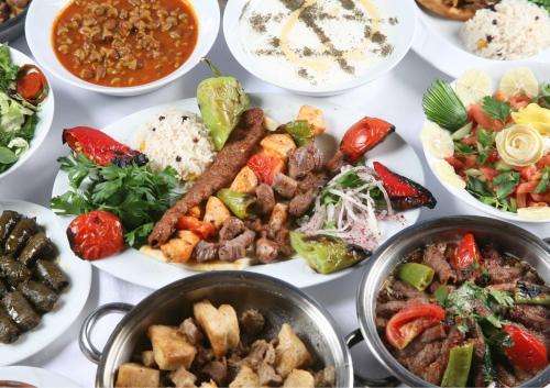 een tafel gevuld met verschillende soorten voedsel bij Elmira Pera Hotel & - Special Class in Istanbul