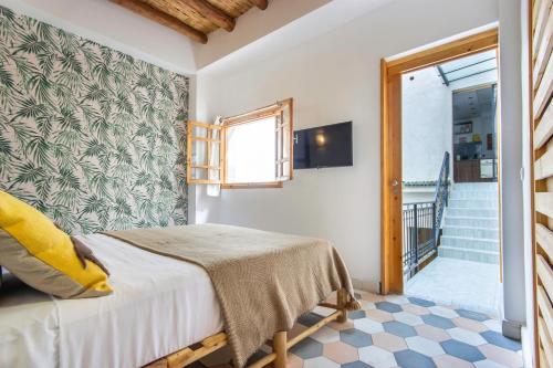 Postel nebo postele na pokoji v ubytování Riad Les Suites Marrakech