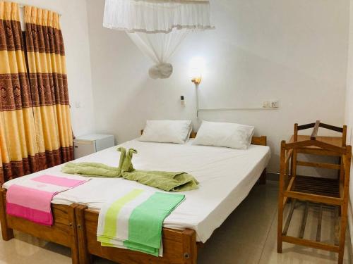 Postel nebo postele na pokoji v ubytování Sigiri Lodge