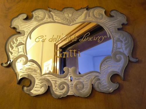 a mirror with the words be delishing in the discovery of faith at Ca' Dell' Arte Luxury in Venice