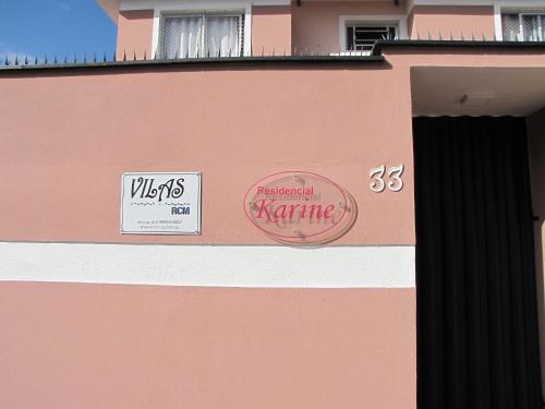 a pink building with signs on the side of it at RCM Vilas - Studio n17 in Joinville