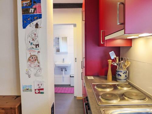 a kitchen with a counter and a sink in it at Holiday Home Chalet Ninette by Interhome in Eischoll