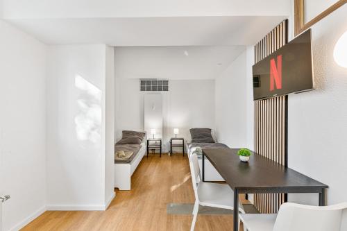 a living room with a table and a couch at Monteurwohnungen in Göppingen 04-07 in Göppingen