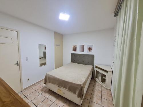Katil atau katil-katil dalam bilik di Apto no CENTRÃO do Balneário
