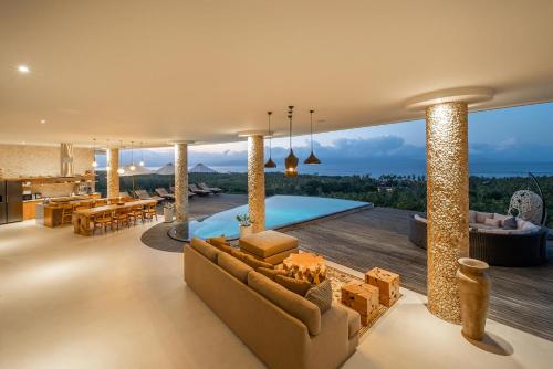 an image of a living room with a swimming pool at Villa Kalliste in Nusa Penida