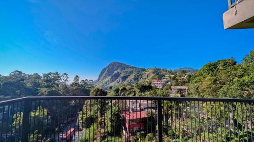 a balcony with a view of a mountain at Oak Ray La Ella Breeze in Ella