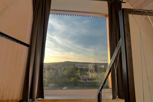 a window with a view of a city at Kyjoff - Domeček s krásnými výhledy in Kyjov