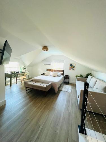 a large bedroom with a bed and a couch at La Casita in Miami