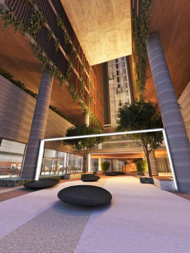 a lobby of a building with a black rug at Flat no New Time à beira-mar em Pajuçara Cama Queen in Maceió