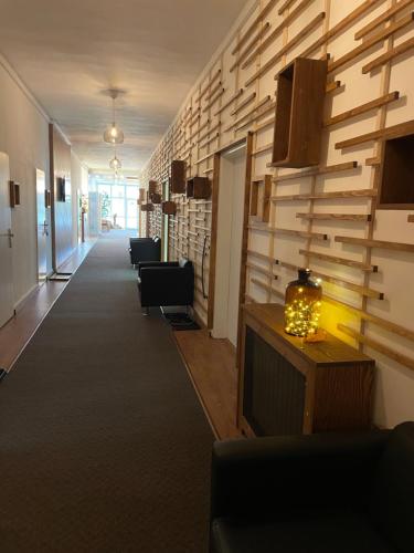 a hallway with chairs and a television in a office at Lázně Meziboří in Meziboři