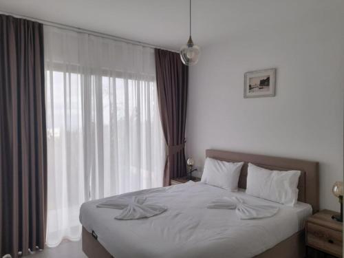 Postel nebo postele na pokoji v ubytování Retreat, block A2, unit 3