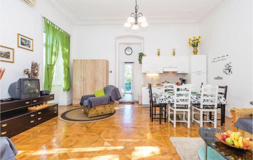 a living room with a kitchen and a dining room at Beautiful Apartment In Rijeka With Wifi in Rijeka