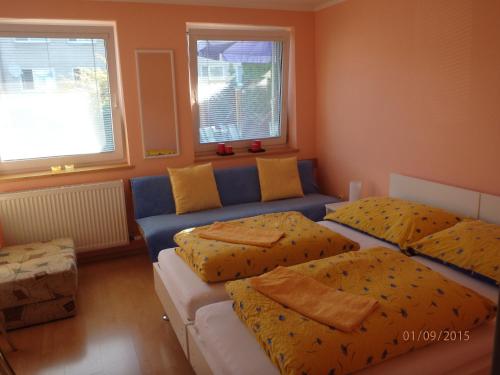 a living room with two beds and a couch at Privat Ján Vereš in Rajecké Teplice