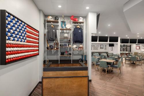 a restaurant with an american flag on the wall at Doubletree by Hilton Fort Myers at Bell Tower Shops in Fort Myers