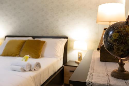a bedroom with a bed with a globe on a table at A Casa di Franca Villa con piscina in Gambassi Terme