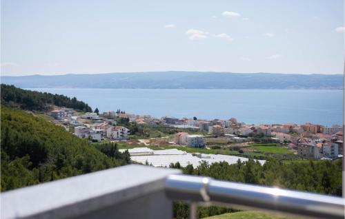 a view of a city and a body of water at Beautiful Apartment In Podstrana in Podstrana