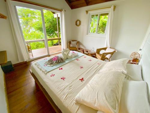 a bedroom with a large bed with stars on it at Bird Island Bungalows in Bocas del Toro
