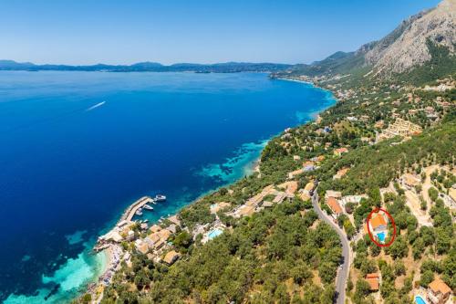 an aerial view of the shore of a lake at Villa Theodora in Nisakion