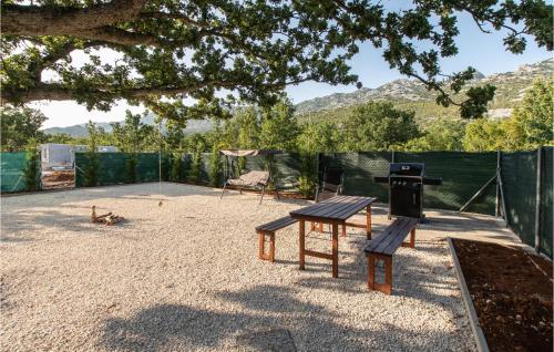 a playground with a grill and a picnic table at Lovely Home In Seline With Sauna in Seline