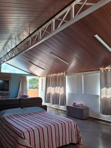 Voodi või voodid majutusasutuse Loft em Itaipava toas