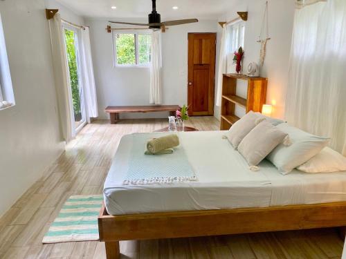 a bedroom with a large bed in a room at Bird Island Bungalows in Bocas del Toro