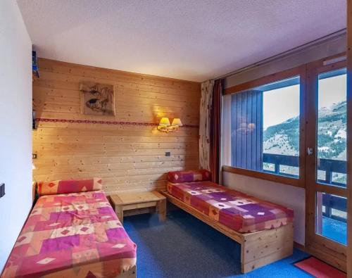 Ένα ή περισσότερα κρεβάτια σε δωμάτιο στο Studio cosy à Méribel Mottaret - 27 m² avec balcon