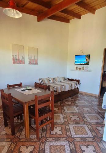 a living room with a table and a couch at Apartamento Del Paseo in Federación
